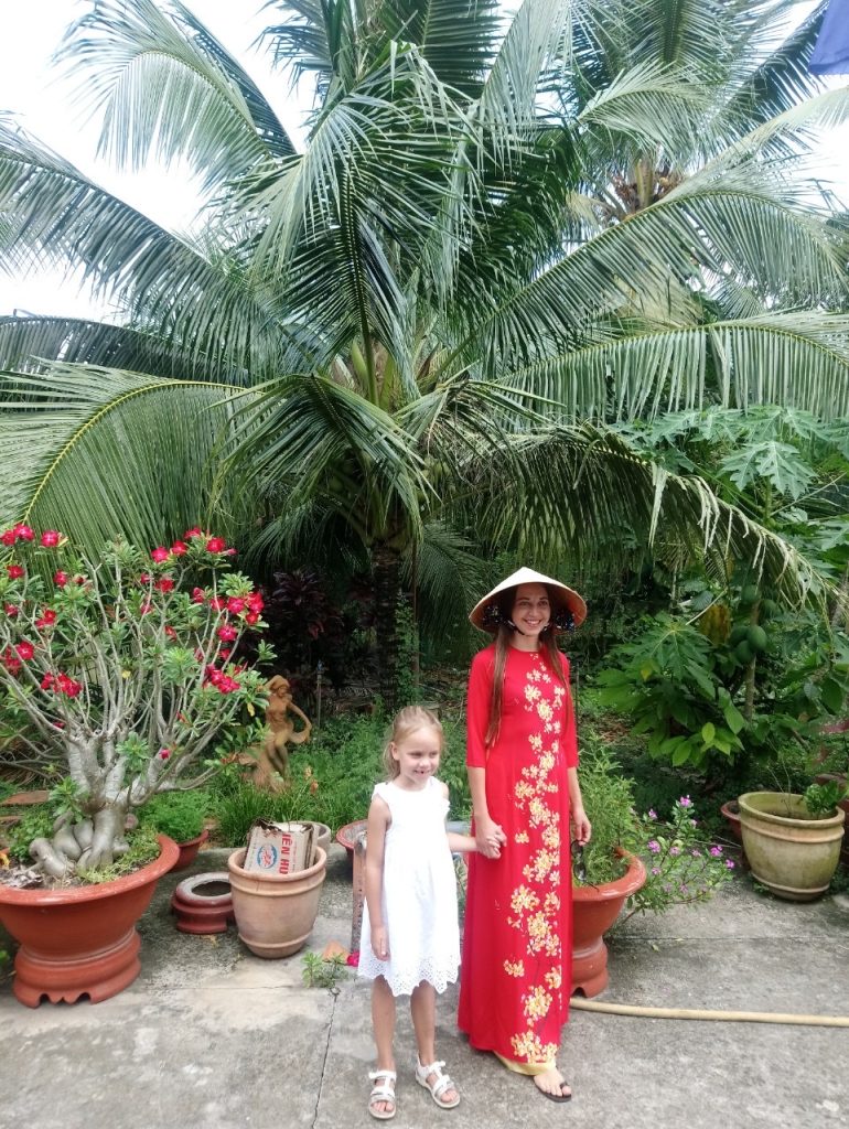 Tourists in Vietnamese traditional long dress