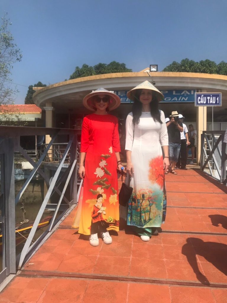 Tourists in Vietnamese traditional long dress